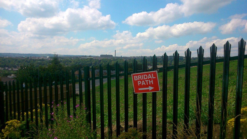 Down from the hilltop via a path warning of weddings!